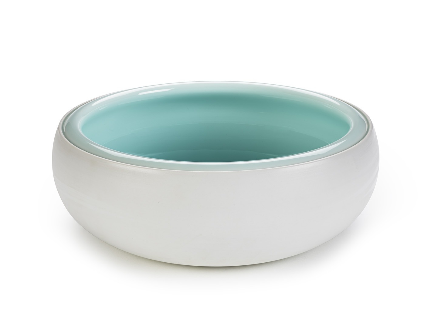white bowl with green interior. Courtesey of V&A