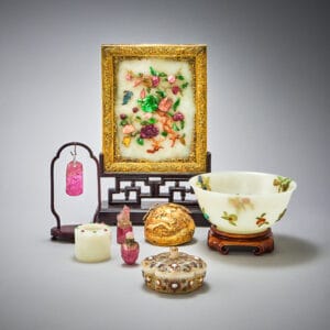 a selection of jade objects including a picture , bowl and pendant