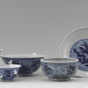 Set of table services with dragons amid waves, excavated from the Imperial Kiln site (2014). Courtesy of the Jingdezhen Imperial Kiln Museum.